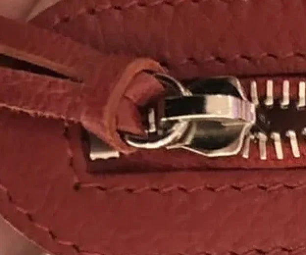 To authenticate a Balenciaga handbag, check Lampo Zippers