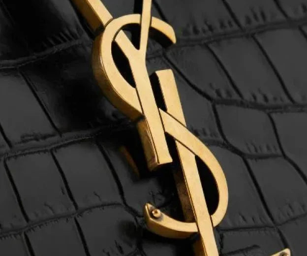 One of the steps to authenticate a Saint Laurent bag is to verify logo and branding