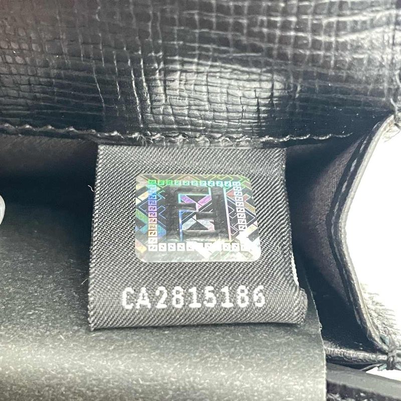 Fendi interior holographic authenticity tag with the serial number printed across it