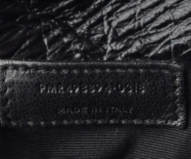 One of the steps to authenticate a Saint Laurent bag is to conduct a visual inspection of serial number